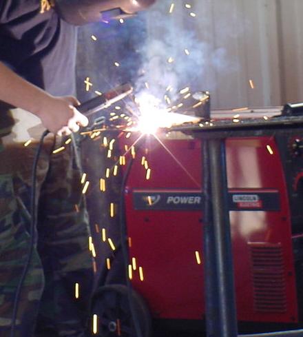 This is a person using the oxy-acetylene welding torch